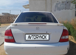 Mazda 323 2003 года