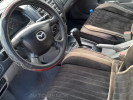 Mazda 323 2003 года
