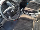 Mazda 323 2003 года