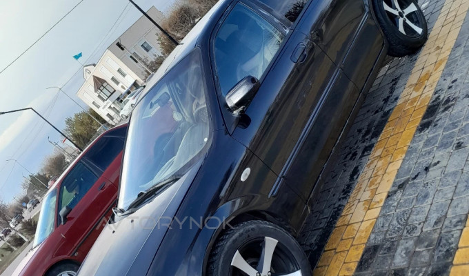 Mazda 323 2003 года