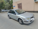 Mazda 323 1999 года