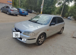 Mazda 323 1999 года