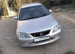 Mazda 323 2003 года