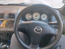 Mazda 323 2003 года