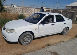 Mazda 323 2003 года
